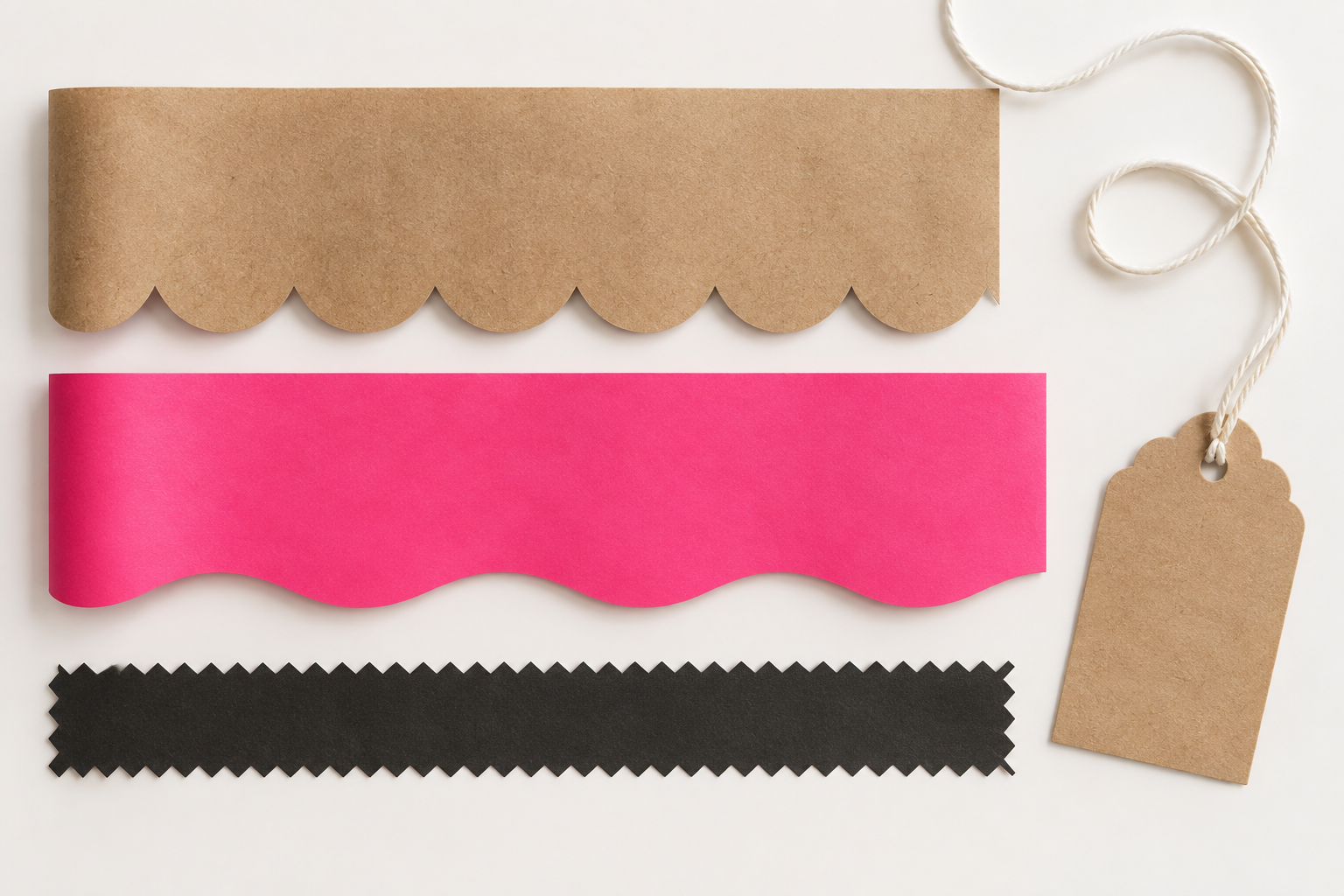 Kraft, pink and black wrapping papers showing scalloped, wave and zigzag decorative edges